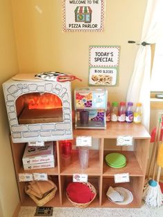 a pizza oven sitting on top of a wooden shelf