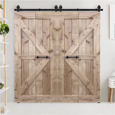 an open wooden sliding door in a white room