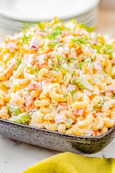 a bowl filled with macaroni salad on top of a table