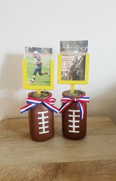 two mason jars with football pictures in them