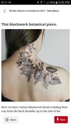 a woman's back tattoo with flowers and leaves