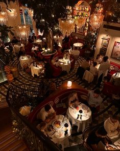 an overhead view of a restaurant with many tables and people sitting at the tables eating