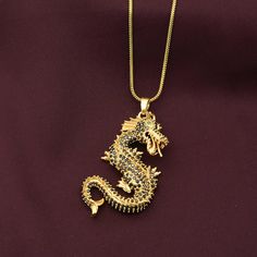 Product:-Pendant  Material:- Brass Gold Vegan Dragon Pendant, Dragon Pendant, Dragon Suede Necklace, Pendant For Men And Women, Gift For Friend, Unique Dragon Pendant, Gothic  ❥ Customers' satisfaction is our biggest priority, please contact us with any questions/queries for future or existing orders, and we will do our best to make sure you are happy with your order. ❥Please make sure to add the correct address during checkout. You can return your purchased item within 15 days after successful delivery. We offer a 100% "Money Back Guarantee" if you are not satisfied with your purchase. ❥If you are not satisfied with your purchased items then contact with us first before leaving negative or neutral feedback or opening disputes. We believe in solving the issues. Necklace Pendant For Men, Rose Gold Dragon Necklace, Gold Fantasy Dragon Necklace, Unique Dragon Design Pendant Jewelry, Unique Dragon Design Pendant Necklace, Suede Necklace, Necklace Dragon, Yellow Gold Dragon Pendant Jewelry, Pendant For Men