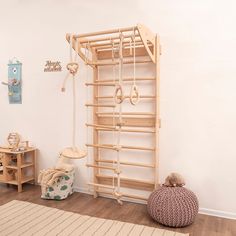 a child's play room with toys and accessories on the floor in front of a white wall