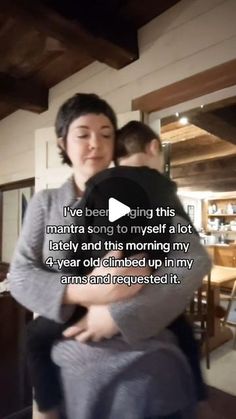 a woman holding a child in her arms with the caption i've been being this manta song to myself