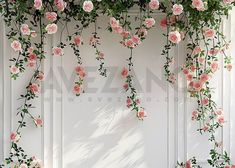 pink roses are growing up the side of a white wall with green leaves on it