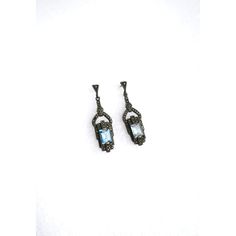 A beautiful pair of blue aquamarine gemstone and sterling silver drop earrings in the Art Deco style, circa late-20th century. Earrings are for pierced ears. Very Good condition as shown in images. No issues. Marked '925' for sterling silver on back of both as shown in last image. A beautiful pair to dress up or down. Dimensions: 1.88" Long Formal Topaz Earrings, Fine Jewelry Aquamarine Earrings For Formal Occasions, Formal Aquamarine Earrings Fine Jewelry, Art Deco Blue Drop Earrings, Fine Jewelry Blue Topaz Drop Earrings, Blue Topaz Drop Earrings Fine Jewelry, Blue Topaz Fine Jewelry Earrings For Formal Occasions, Art Deco Silver Gemstone Earrings, Silver Art Deco Gemstone Earrings