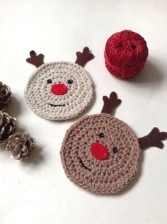 three crocheted christmas ornaments with red nose, nose and antlers on them