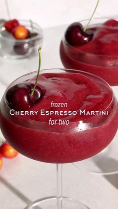 cherry espresso martini for two with fresh cherries on the rim, ready to be served