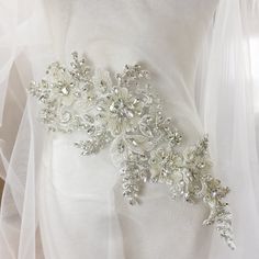 Pure hand beaded sewn silver crystal and rhinestone beaded bodice applique Size for one piece is about 16X44cm Gorgeous for wedding, couture design, bridal gown straps ... Back to rhinestone section https://www.etsy.com/shop/lacetime/items?ref=seller-platform-mcnav&section_id=15471438 my shop link: http://www.etsy.com/shop/lacetime ------------------------------------------------------ ---------------------------------------------------------------- ------------------------------------------ Silver Embellished Bridal Belt, Embellished Silver Bridal Belt, Embellished Crystal Bridal Belt, White Crystal Bridal Belt With Rhinestones, Fitted Crystal Embellished Bridal Belt, Fitted Crystal Bridal Belt Embellished, White Rhinestone Bridal Belt, White Embellished Lace Bridal Belt, Embellished White Lace Bridal Belt