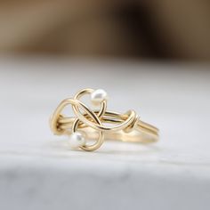 A unique ring with a classy touch just for you! Handmade with love, set with two fresh water pearls ☆ WHY THIS PIECE OF J E W E L R Y IS AWESOME! ☆ * Hand finished and made from high quality raw materials * Long lasting beauty & Timeless design * Available in Gold, Rose Gold or Sterling Silver ♡ WRAPPING ♡ * All 23 Summers jewels arrive in a cute pouch or gift box so they are gift ready. DELIVERY ✉ * Most items are ready made but some are made to order, Times for each items are shown on * We Elegant Gold Hand Wrapped Rings, Elegant Hand Wrapped Rings For Anniversary, Elegant Wire Wrapped Promise Ring, Elegant Wire Wrapped Pearl Ring For Wedding, Elegant Wire Wrapped Pearl Wedding Ring, Elegant White Wire Wrapped Pearl Ring, Minimalist Hand Wrapped Wedding Rings, Handmade Minimalist Pearl Ring For Wedding, Elegant Adjustable Wire Wrapped Pearl Ring