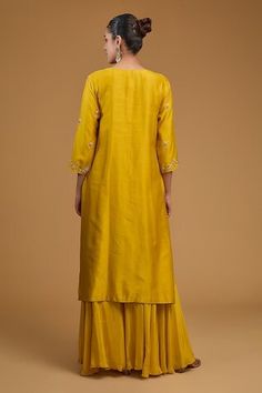 Mustard yellow kurta with beads, sequins, dabka, gota patti and dori embroidered yoke in floral motifs. Paired with solid sharara and an embroidered dupatta. - Aza Fashions Yellow Sets With Gota Work For Transitional Season, Yellow Sets With Gota Work For Seasonal Transition, Transitional Yellow Sets With Gota Work, Transitional Yellow Sharara With Zari Work, Yellow Sharara With Dori Work, Traditional Yellow Palazzo Set With Dori Work, Transitional Yellow Sharara With Pallu, Transitional Season Yellow Sharara With Pallu, Transitional Yellow Traditional Wear With Dori Work