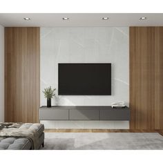 a large flat screen tv mounted to the side of a wall in a living room