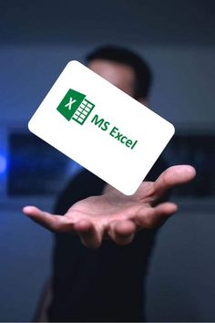 a person holding up a business card with the word ms excel on it in their hand