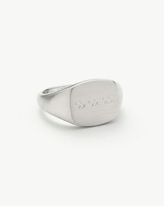 Mens Engravable Signet Ring | Sterling Silver. Handcrafted for Him. The Classic Signet Ring in Sterling Silver is Upgraded with a Brushed Finish and Rounded Edges, Plus It Can be Engraved on Top and on the Band's Outer Sides. Pair with a Chunky Chain Bracelet for a Statement Look. Please Note: Engraving Items May Take 7-10 Working Days to Process. Metal: Rhodium Plated on Recycled Sterling Silver Dimensions: 12. 5mm X 11. 5mm Weight: 7. 5g Product Code: Mj-S-R4-Ns Modern Adjustable Engraved Signet Ring, Classic Rings With Engraving Option For Everyday, Classic Rings With Engraving Option, Classic Formal Rings With Engraved Logo, Classic Engraved Ring With Logo For Anniversary, Classic Ring With Engraved Logo, Classic Engraved Ring With Logo As Gift, Classic Engraved Ring With Logo For Gift, Classic Engraved Ring With Logo