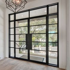 Thermal break iron french double door with sidelight and transom Black Iron Doors Interior, European French Doors, Black Iron Doors, French Doors For Office, French Doors To Office, Doors In Living Room, Door With Sidelights And Transom, Wide French Doors, French Doors With Sidelights