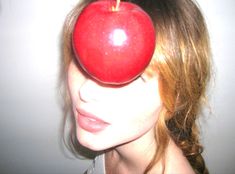 a woman with an apple on her head