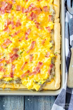 a casserole dish with ham and cheese on top, ready to be eaten