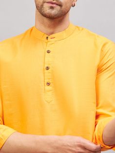 VM BY VASTRAMAY Men's Orange Short Cotton Kurta A stylish choice for casual outings, this orange short cotton kurta from VM BY VASTRAMAY is comfortable and trendy. It features a mandarin collar, short sleeves, and a straight hemline. Pair it with jeans or casual trousers for a complete look. Features: Color: Orange Material: Cotton Pattern: Solid Neck: Mandarin Collar Sleeve: Short Sleeve Specifications: Brand: VM BY VASTRAMAY Fit: Regular Fit Occasion: Casual Wash Care: Hand Wash/Machine Wash Country of Origin: India Material & Care: Cotton Hand-wash or machine wash in cold water with mild detergent Do not bleach or wring Dry in shade Warm iron, if needed Legal Disclaimer: The product is guaranteed to be 100% genuine. Product images are for illustrative purposes only. Images/packaging/ la Traditional Orange Cotton Tops, Casual Orange Kurta For Summer, Traditional Solid Cotton Kurta, Orange Cotton Long Sleeve Kurta, Long Sleeve Orange Kurta For Summer, Orange Long Sleeve Kurta For Summer, Long Sleeve Orange Cotton Kurta, Summer Long Sleeve Orange Kurta, Casual Long Sleeve Yellow Kurta