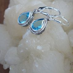 Elegant Blue Topaz Earrings; 925 Sterling Silver; Secure Backs; Drop and Dangle; Genuine Gemstone Earrings; Handmade Jewelry; Gift for Her Swiss Blue Topaz Earrings. Handmade in Bali Length 1.14 inch Stone Size 9x6mm 🎁Great as a gift for yourself or someone else. Free Gift Packaging -- just let us know! Please message us with any questions -- we are happy to help!! 💙Blue Topaz Metaphysical Properties 💙 Inspires creativity 💙 Promotes calm and aids in meditation 💙 Increases psychic abilities Silver Teardrop Topaz Earrings, Silver Topaz Teardrop Earrings, London Blue Topaz Jewelry, Blue Topaz Jewelry, Topaz Jewelry, Blue Topaz Earrings, Garnet Jewelry, Handmade Jewelry Gift, Peridot Gemstone