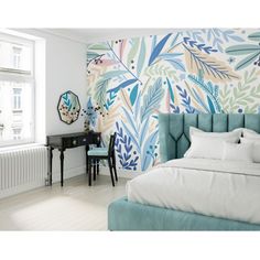 a bedroom decorated in blue and white with an artistic wall mural behind the headboard