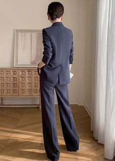 Elevate your office wardrobe with our Clara Double Breasted Blazer & Wide Pants Suit Set. The luxurious grey-blue color exudes sophistication and the wide leg pants give off an elegant and professional vibe. Perfect for the stylish career woman, this set exudes a timeless, British-inspired charm. Blazer: Double Breasted closure Notched lapels Long sleeves Front flap pockets Pants Zip fly with button closure Side slant pockets Regular length - Polyester, spandex- Item #432603- Women's blazer & pa