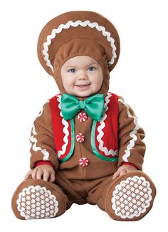 a baby dressed in a gingerbread costume