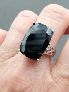 Beautiful Estate, 20x14mm Jumbo Rectangle Cushion Cut Black Tourmaline 925 Sterling Silver Ring.  This beautiful ring is sure to receive many compliments!  SOLID 925 STERLING SILVER, FULLY TESTED, NOT PLATED OR FILLED.  Ring Size: 9  Width: 20mm - 2.5mm  Sits 9mm tall on finger  Gemstone: Tourmaline  Weight: 8.8 Grams  Hallmarked: 925 / N / Thailand   We gladly combine shipping!  Everything is packed with care to make sure it arrives safely.  We only sell authentic items. If it is a name brand item, we guarantee it to be authentic.  If it is made of precious metals and or gemstones, we guarantee it to be as described.  Please check our feedback and buy with confidence.  We work very hard to make sure you are happy doing business with us, and we appreciate your positive feedback very much! Rectangle Cushion, Rectangle Pillow, John 3 16, Beautiful Ring, Black Tourmaline, Cushion Cut, Rings Statement, Solid 925 Sterling Silver, Sterling Silber