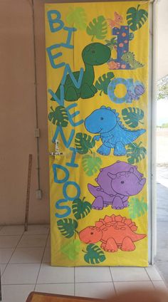 a door decorated with dinosaurs and leaves