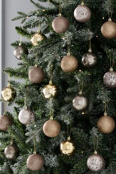 a christmas tree with ornaments hanging from it