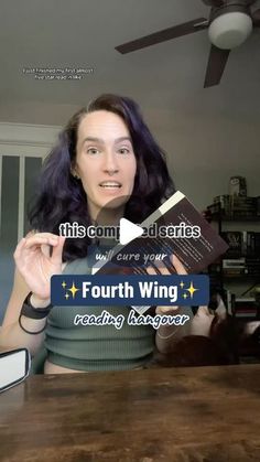 a woman holding up a book in front of her face with the caption fourth wing reading reader