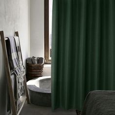 a bath room with a tub and a shower curtain