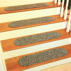 the carpeted stair treads have been placed on top of each other to protect them from falling