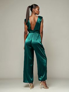 This soft satin jumpsuit features a flattering v-neck design, making it the perfect choice for mothers of the bride. Its dress pantsuit style provides comfort and elegance, while its high-quality material ensures a polished look. Stay stylish and comfortable on that special day with our jumpsuit. Sleeveless Satin Jumpsuit Or Romper, Sleeveless Satin Jumpsuits And Rompers, Sleeveless Solid Color Satin Jumpsuits And Rompers, Sleeveless Satin Jumpsuits For Evening, Chic Satin Jumpsuits And Rompers In Solid Color, Chic Satin V-neck Jumpsuits And Rompers, Chic Solid Color Satin Jumpsuits And Rompers, Satin V-neck Jumpsuits And Rompers For Party, Satin Jumpsuit With V-neck For Party