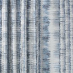 an image of a curtain with blue and white stripes on the outside, as if it were drapes