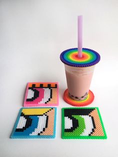 a cup and coasters with a drink in it