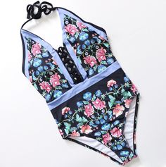 FINAL SALE: This item cannot be returned or exchanged. Embrace timeless elegance with the One Piece Women Floral Swimsuit. This sophisticated swimsuit features a beautiful floral print that exudes a fresh, summery charm, perfect for sunny days by the water. Designed with both style and comfort in mind, it offers a flattering fit that enhances your natural silhouette. The durable fabric provides excellent support, ensuring you feel confident and chic whether lounging poolside or enjoying a seaside escape. Step into effortless glamour with this stunning floral one-piece swimsuit, a must-have addition to your swimwear collection. Spring Swimming Tankini Beachwear, Summer Printed One-piece Tankini, Printed One-piece Tankini For Summer, Halter Neck Tropical Print Swimwear For Summer, Spring Halter Neck Tankini, Fitted Floral Print Tankini For Pool, Spring Halter Neck Tankini For Swimming, Spring Printed Tankini For Swimming, Printed Tankini For Spring Swimming