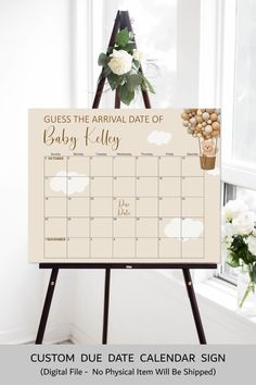 a calendar sign with flowers on it and the date for baby kleyyg