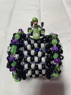 a toy car is made out of beads