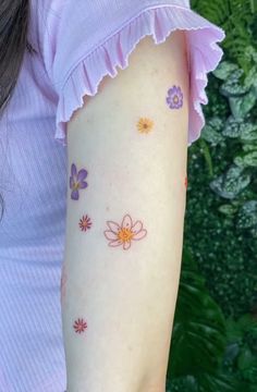 a woman with flowers on her arm