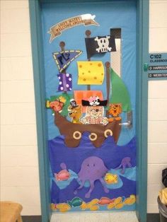 a door decorated to look like a pirate ship with an octopus and other animals on it