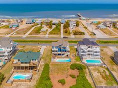 an aerial view of the beachfront homes and swimming pool in ocean isle, nc