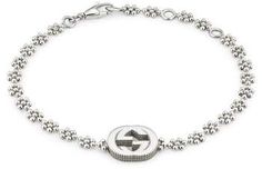 Gucci Interlocking-G Bracelet Designer Silver Jewelry With Logo Charm, Formal Silver Jewelry With Logo Charm, Modern White Gold Jewelry With Logo Charm, Luxury Silver Jewelry With Logo Charm, Luxury Metal Jewelry With Logo Charm, Elegant Silver Bracelet With Logo Charm, Classic White Gold Jewelry With Logo Charm, Designer Metal Jewelry, Designer Metal Bracelets With Logo Charm