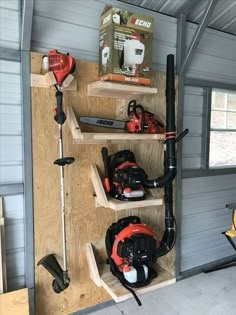 a garage with tools on the shelves in it