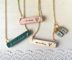 three different necklaces with names on them