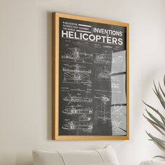 a white chair sitting in front of a black and white poster on the wall next to a potted plant