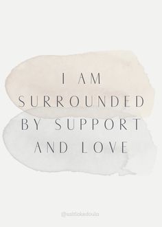 the words i am surrounded by support and love are painted in shades of gray, white and beige