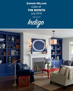 a living room with blue bookcases and white fireplace in the center, along with an indigo color scheme