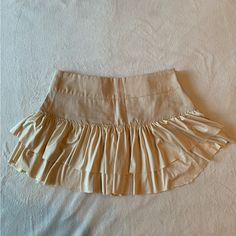 Women’s Cream Colored Mini Skirt With Zipper On The Side And Zipper On The Back For Design. Very Soft Material On The Bottom. Never Worn Before Still In Amazing Condition. Beige Fitted Tiered Skirt Skort, Beige Fitted Tiered Skort, Fitted Beige Tiered Skort, Chic Beige Skirted Skort, Spring Beige Skirted Skort, Beige Skirted Skort For Spring, Spring Beige Skort, Beige Pleated Mini Skirt, Cream Skirt