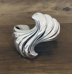 (eBay) Kabana Cuff Bracelet Sterling Silver. Heavy Swirl Bracelet 2 1/2” wide 78.4 grams Fit a medium to large wrist Handmade USA We ship USA only! (No Alaska or Hawaii) Elegant Wide Band Cuff Bracelet With Polished Finish, Elegant Sterling Silver Cuff Bracelet Wide Band, Elegant Sterling Silver Wide Band Cuff Bracelet, Elegant Wide Band Adjustable Bracelets, Elegant Silver Cuff Bracelet With Wide Band, Elegant Sterling Silver Bangle With Wide Band, Elegant Sterling Silver Wide Band Bangle, Elegant Wide Band Sterling Silver Bangle, Elegant Silver Open Band Cuff Bracelet